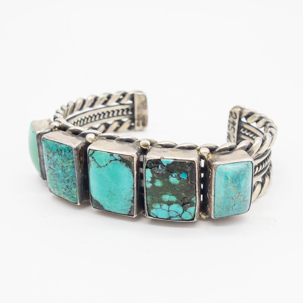 Native American Sterling Silver Turquoise Cuff Bracelet: This is an estate found vintage Native American pawn sterling silver and turquoise cuff bracelet. It appears to be signed, but indistinctly so. The interior circumference of the cuff is 5 1/4" with a