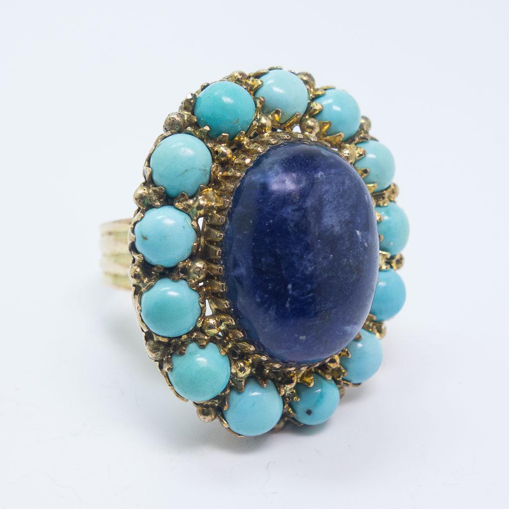 14K Gold Lapis Cabochon Turquoise Cocktail Ring Size 8: This is a vintage ladies cocktail ring rendered in 14K yellow gold. This ring features a large lapis lazuli oval cabochon surrounded by a cluster of turquoise cabochons. The ring is a size 8 US and it
