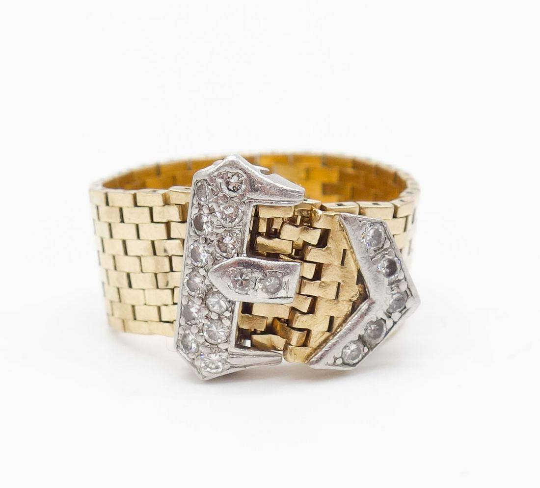 Tiffany 14K White Yellow Gold Diamond Buckle Mesh Ring: This is a ring from Tiffany & Company rendered in 14K yellow gold. The mesh ring is finished in a diamond studded white gold buckle. The full cut diamonds are VS in clarity and G to H in color. The bu