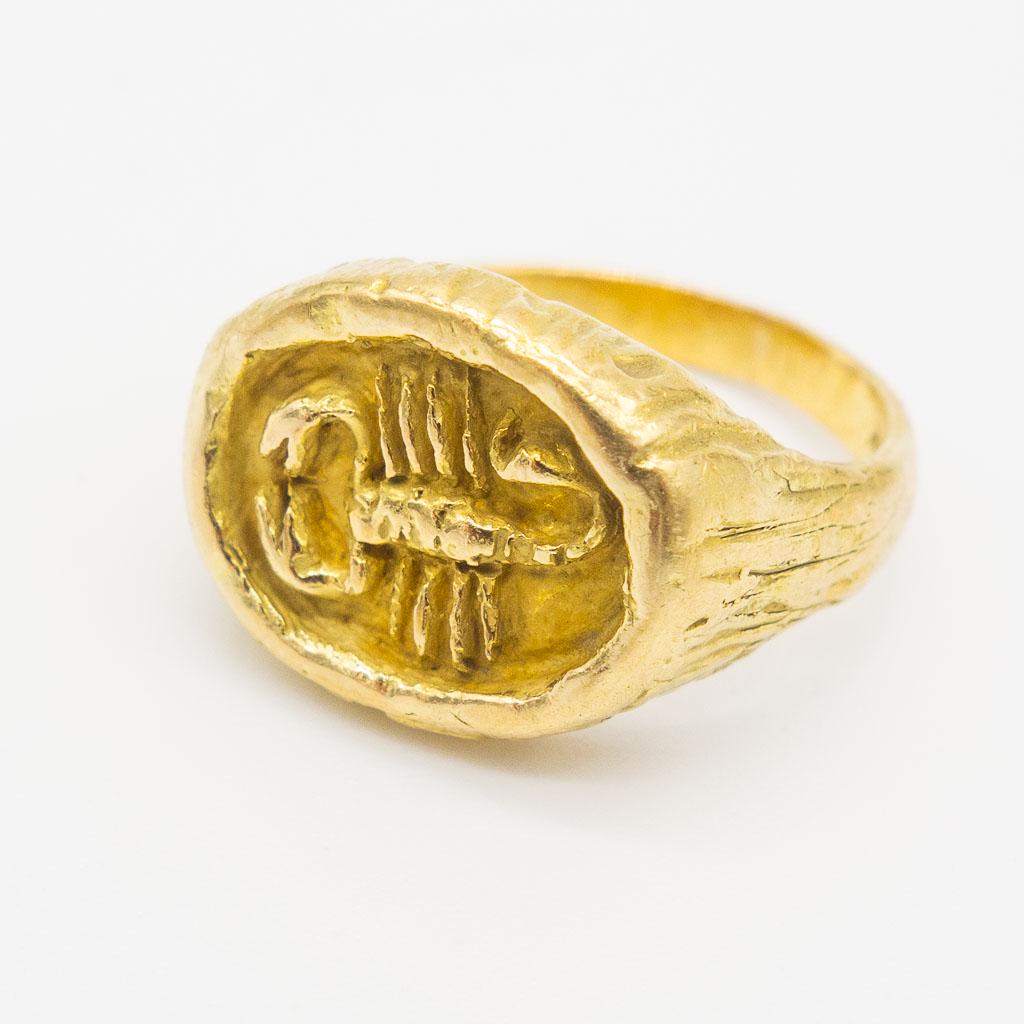 Vintage Tiffany & Co Italy 18K Gold Zodiac Scorpio Ring: This is a vintage ring from Tiffany & Co. Rendered in 18K gold, this Italian ring is part of the Zodiac collection and features the Scorpio sign (October 23 to November 22). Accompanied by a Tiffany j