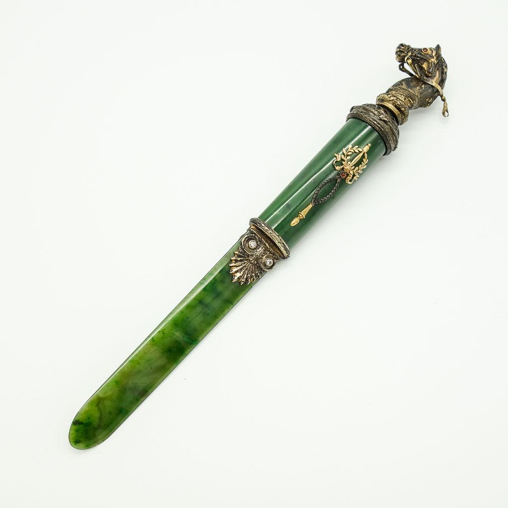 Faberge Horse Head Letter Opener Silver Gold Nephrite: This letter opener in the manner of Faberge features a horse head handle in 84 silver with gold accents. The letter opener is nephrite jade and features round diamond and orange garnet accents. It mea