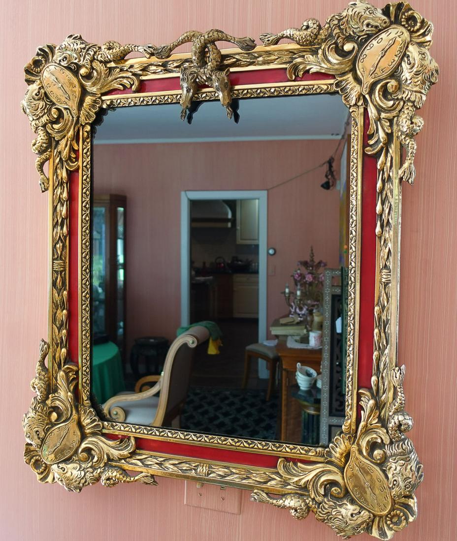Salvador Dali Bronze Framed Surrealist Mirror 1974: This 1974 Salvador Dali framed mirror in gesso, gold leaf, and paint features imagery of his melting clocks from "The Persistence of Memory" and multi-headed hydras from "Les Hydres". It is numbered 2