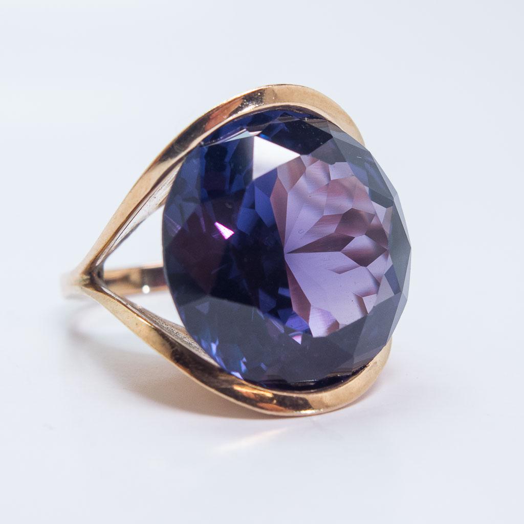 Retro 14K Gold Alexandrine Color-Change Sapphire Ring: This semi bezel set ring in 14K rose gold features a round faceted synthetic color-change sapphire. This stone changes from purple to bluish-violet. This ring is a size 7.25, the center stone is appro