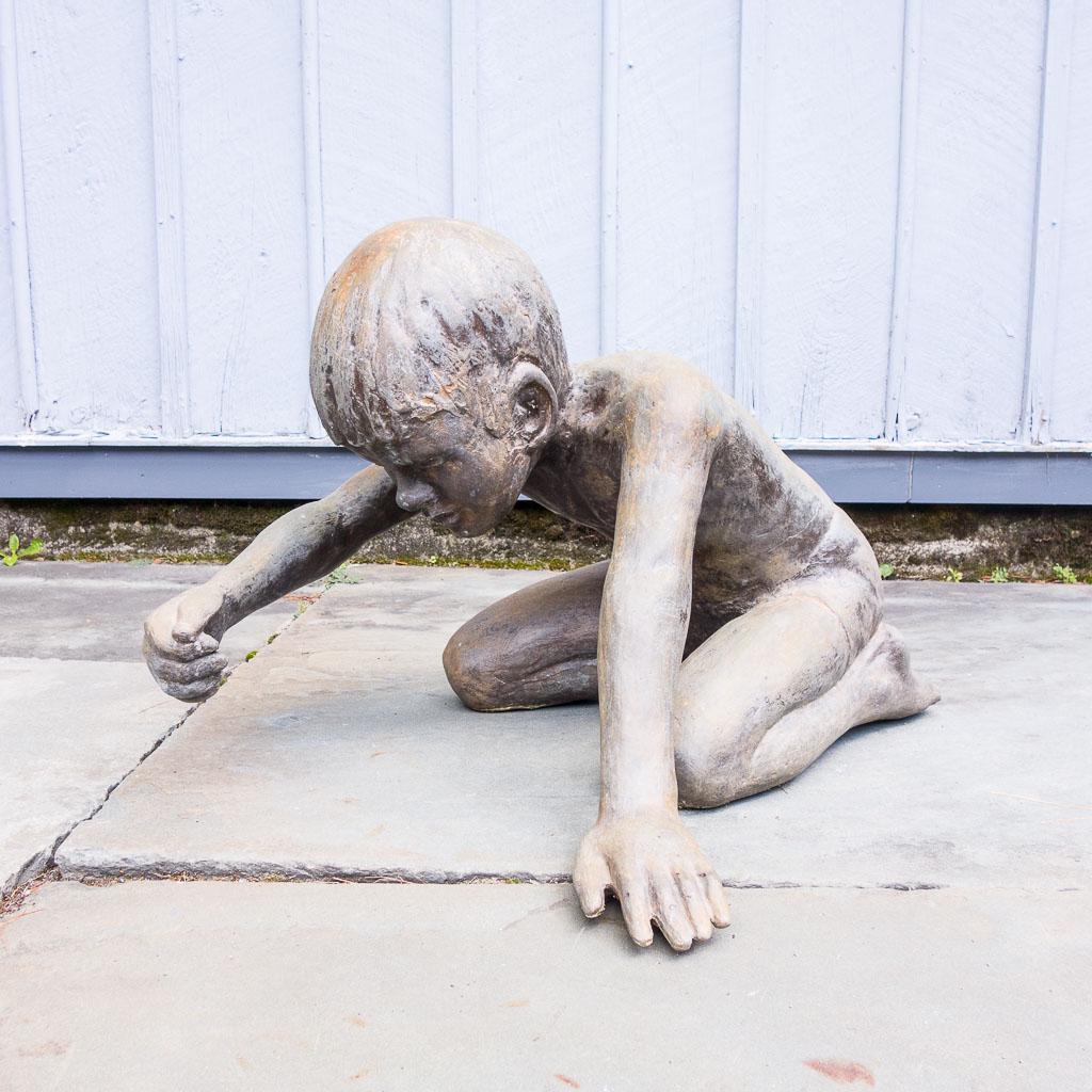 Victor Salmones Castillo Arena Sand Castle Boy Bronze: This is a bronze sculpture titled Castillo de Arena (Sand Castle) by artist Victor Salmones (Mexican, 1937-1989). The life size sculpture features a little boy poised to build a sandcastle. This sculp