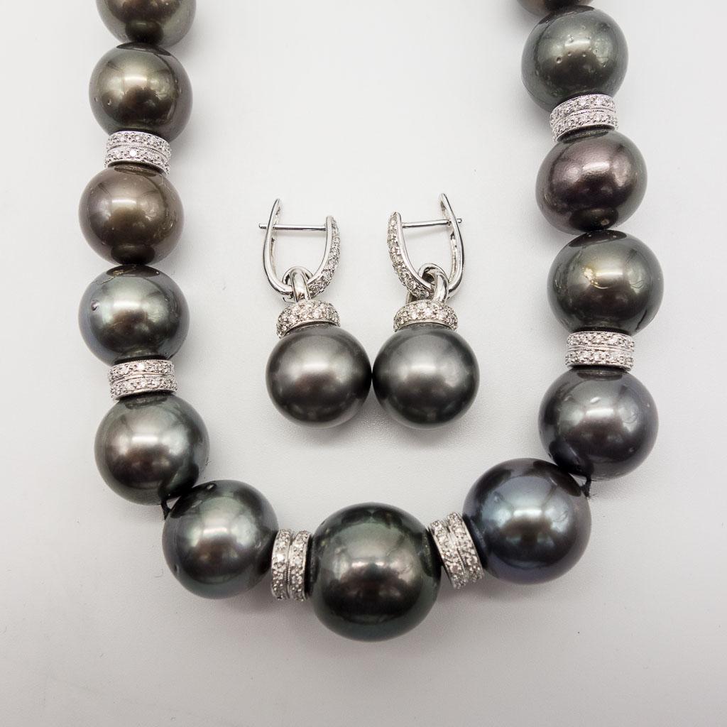 18K White Gold Tahitian Pearl Diamond Necklace Earrings: This slightly graduated strand of round black Tahitian pearls, ranging from 12.5mm to 16mm, is finished with an 18K white gold diamond clasp and rondelles. This strand is accompanied by a pair of matc