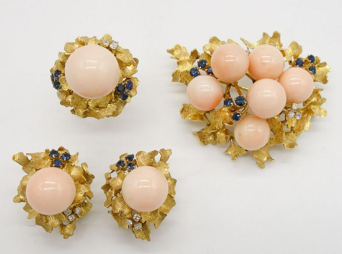 18K Gold Angel Skin Coral Diamond Sapphire Suite: This is a vintage biomorphic brooch, earrings, and ring suite. Rendered in 18K yellow gold, this delicate set features large angel skin coral accented by clusters of single cut diamonds and sapphires.