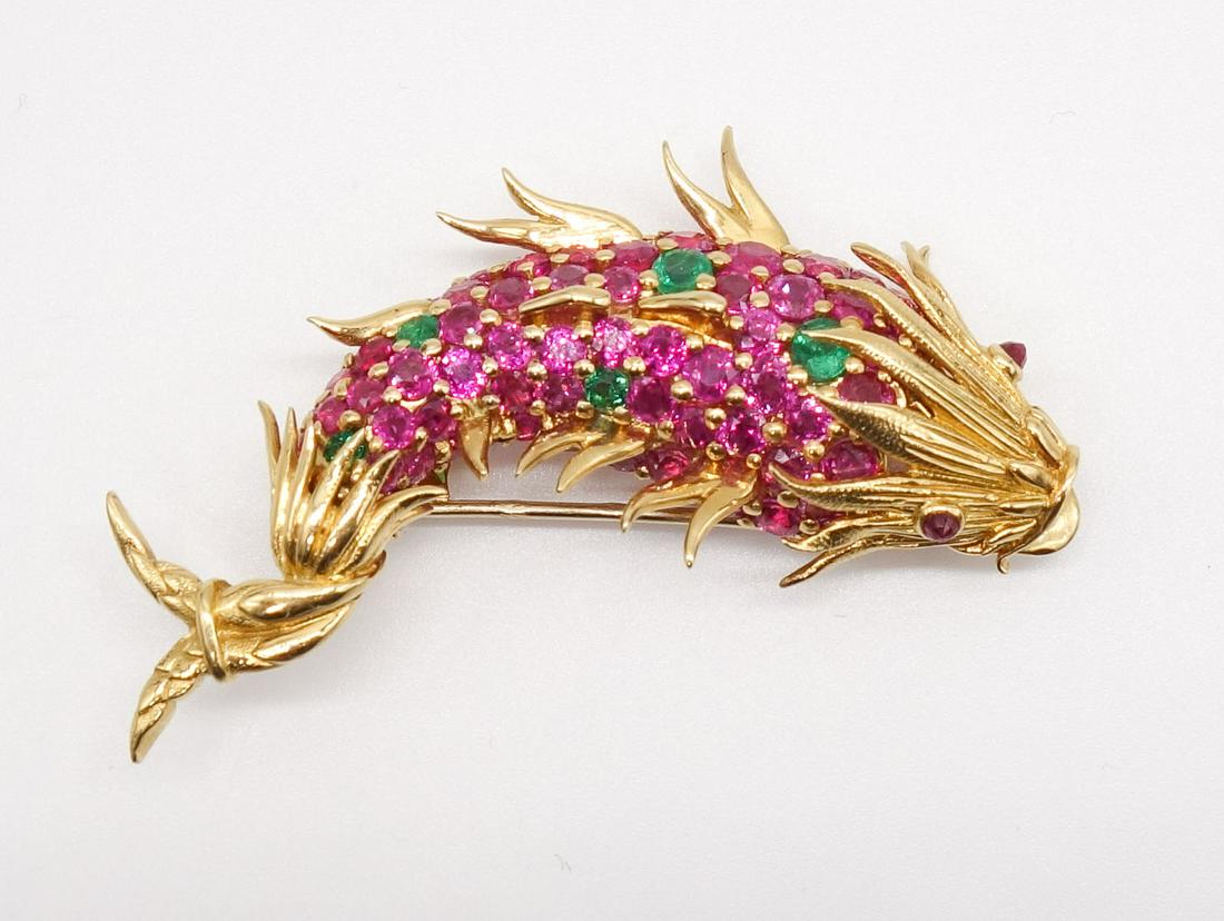Schlumberger Dolphin Fish Brooch Pink Sapphire Emerald: "Dolphin Fish" brooch by Jean Schlumberger for Tiffany & Co. This pin clip is set in 18K yellow gold with round faceted pink sapphire, emerald, and ruby. Accompanied by a Tiffany Schlumberger jewlery 