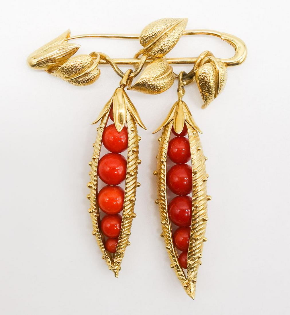 Tiffany Schlumberger 18K Gold Coral Pea Pod Brooch: Double "Pea Pod" brooch is made in 18K yellow gold and coral by Jean Schlumberger for Tiffany & Co. The gold encased coral peas dangle from a pin with a decorative leaf design. Accompanied by a Tiffan