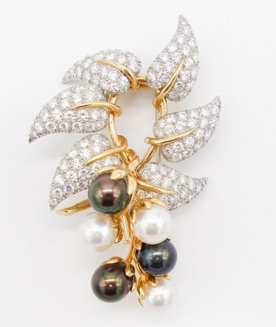 Tiffany Schlumberger 18K Platinum Diamond Pearl Clip: This pearl leaf motif clip brooch is by Schlumberger for Tiffany & Co. It is set in 18K yellow gold in platinum with diamond leaves and a bundle of six round white and black Tahitian pearls. Accompani