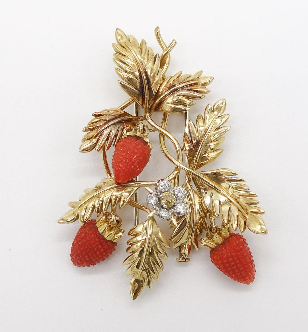 Schlumberger 18K Coral and Diamond Strawberry Brooch: This strawberry clip brooch in 18K gold, coral, and diamond is made by Jean Schlumberger for Tiffany & Co. The piece features three red coral dangling strawberries surrounded by a leaf motif in gold a