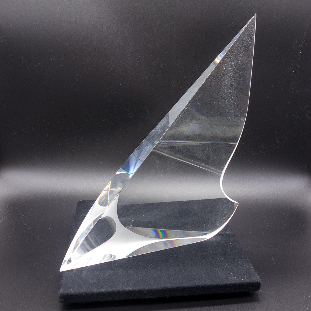 Christopher Ries Crystal Sailboat Figurine: Art crystal sculpture of a sailboat by artist Christopher Ries (American, b.1952). Ries is noted for applying classical sculptural reduction to cold optical crystal rather than using traditional hot t