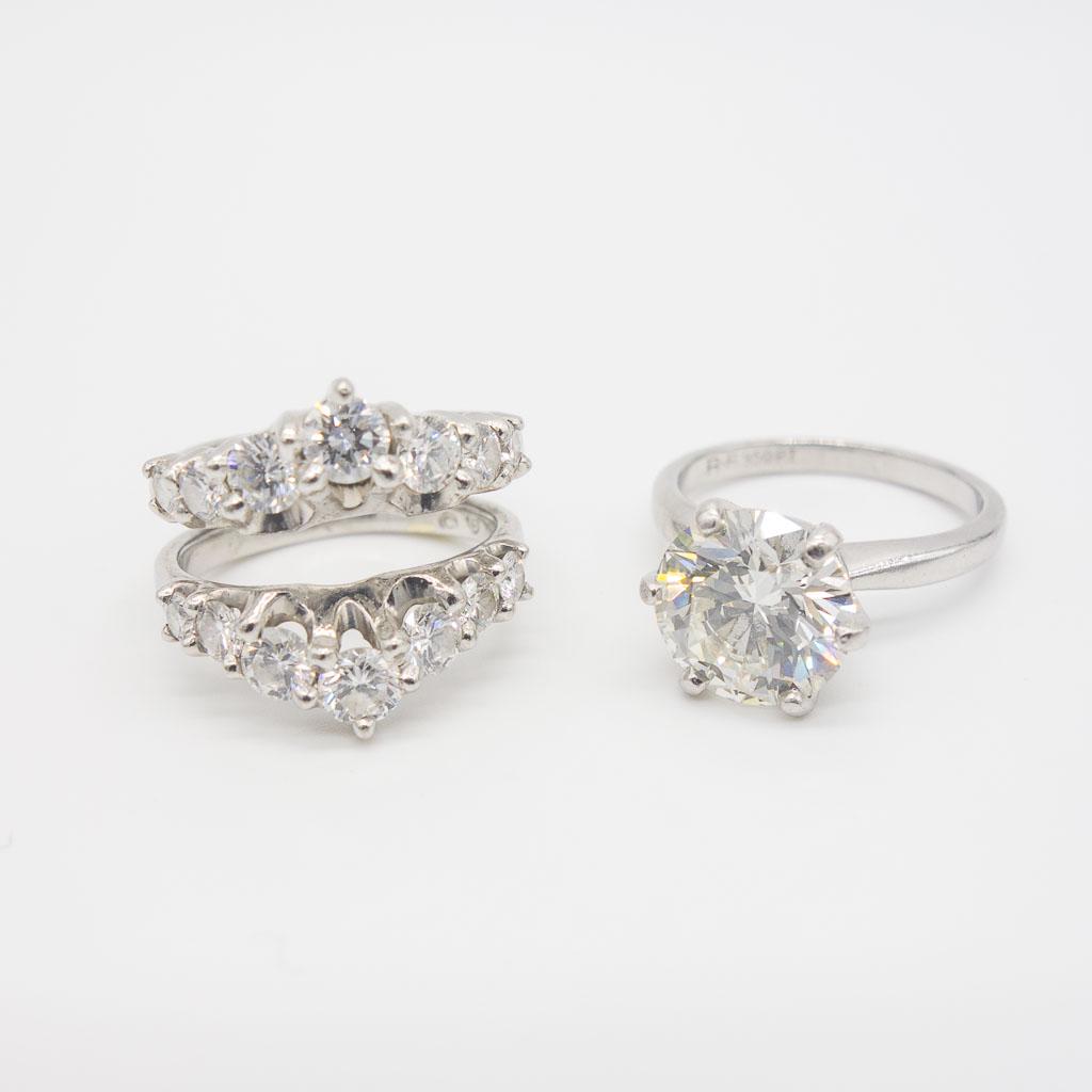 Platinum 3.86ct Round Diamond Ring GIA w Diamond Guard: This platinum ring set features a six prong solitaire ring with a 3.86ct round brilliant cut diamond with a GIA report and a guard wrap ring featuring 14 round brilliant cut diamonds. These rings are 