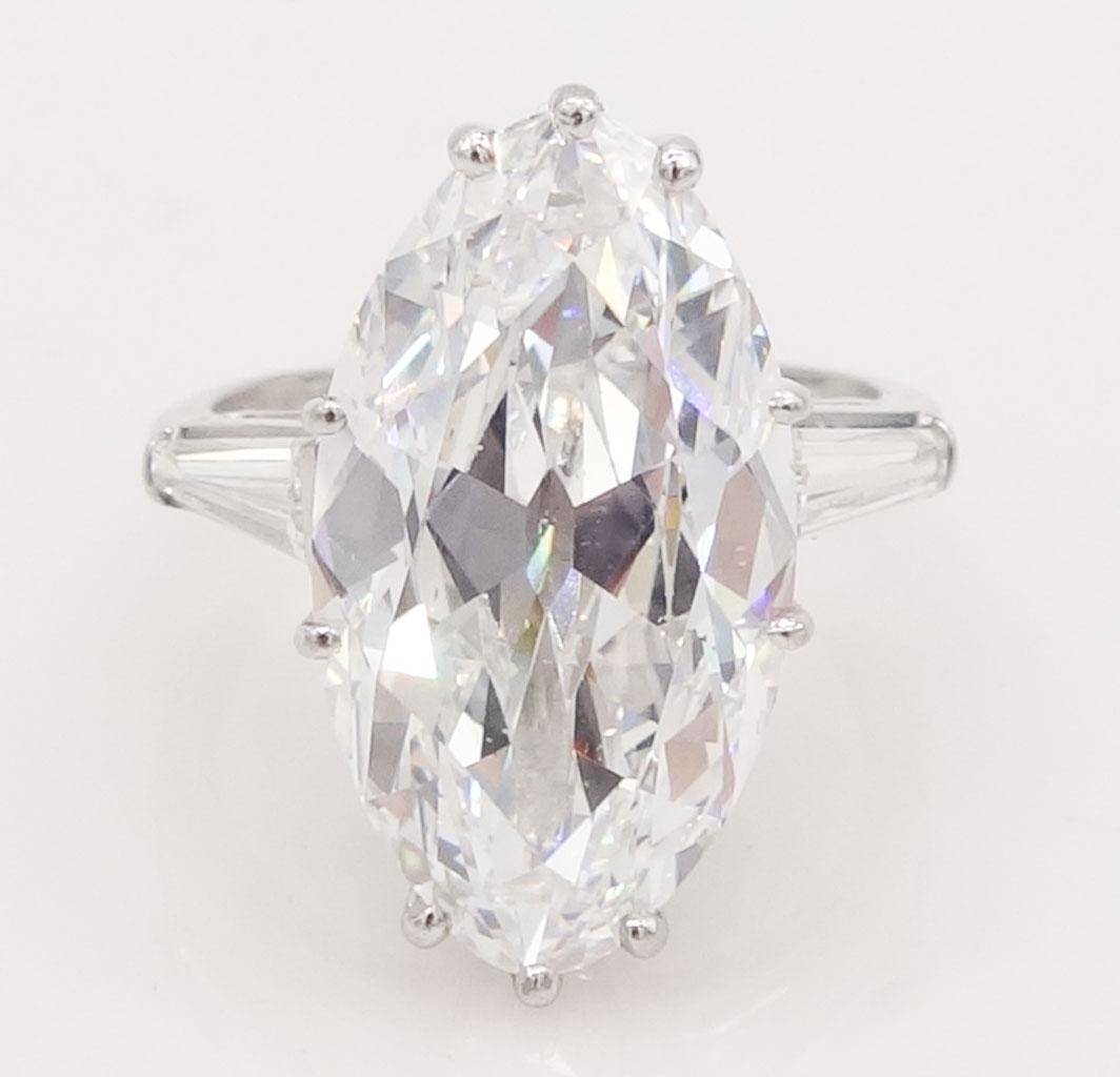 Platinum 10.75ct D VS2 Marquise Diamond Ring GIA Report: Important solitaire diamond ring set in platinum features a marquise cut center diamond flanked by two tapered baguette diamonds. The center marquise-shaped diamonds is 10.75ct, D in color, VS2 in cla