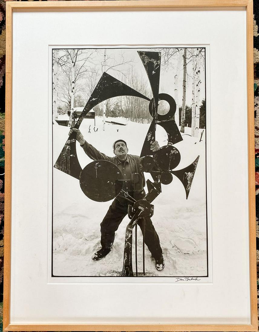 David Smith Portrait & Sculpture Photo Dan Budnick: Photograph by Dan Budnick (American, 1933 - 2020) of sculptor David Smith (American, 1906-1965) with Voltri-Bolton XVIII sculpture, Terminal Iron Works, Bolton Landing, New York, 1963. Numbered 1/2. G