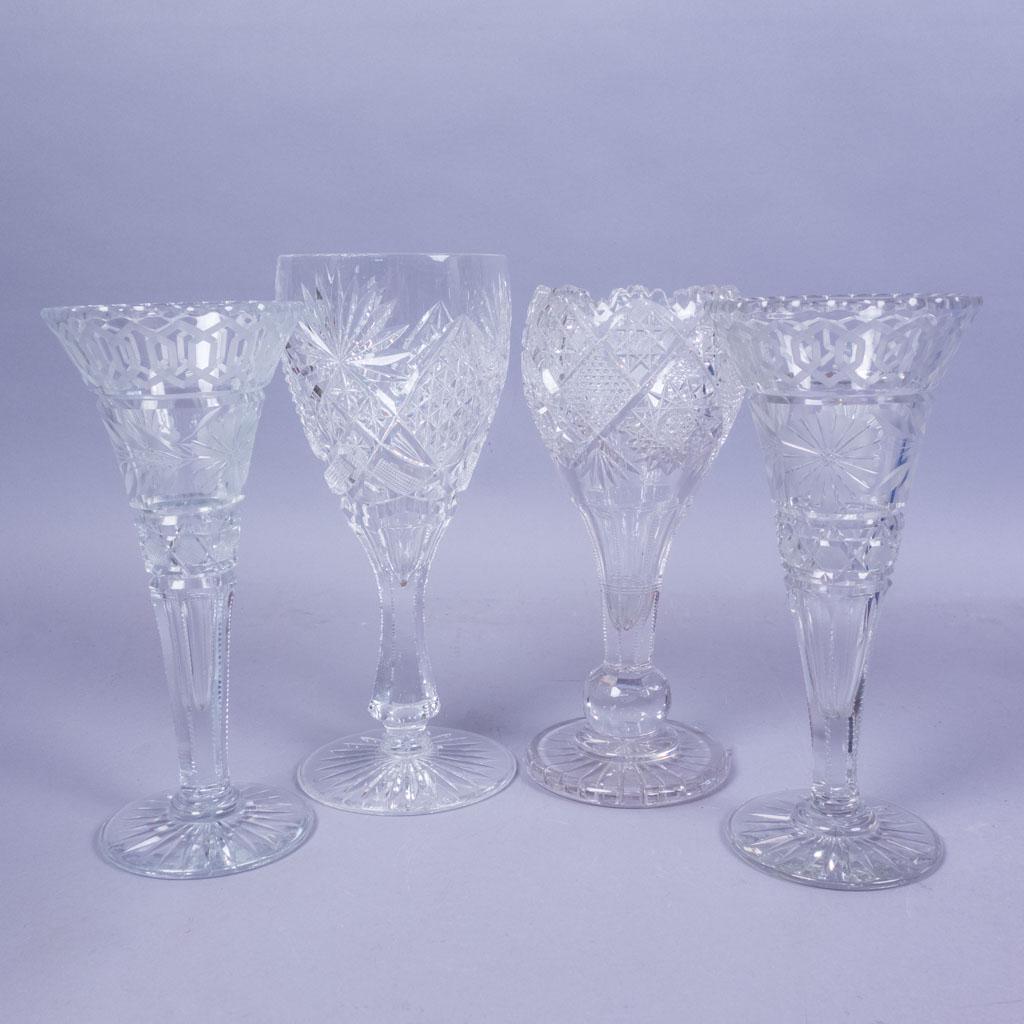 4 Assorted Antique ABP Cut Glass Vases: A lot of four antique American Brilliant Period cut glass vases. Two have a similar hexagonal and floral frosted glass pattern. The other two have wider mouths with cross hatched, circular, and star p