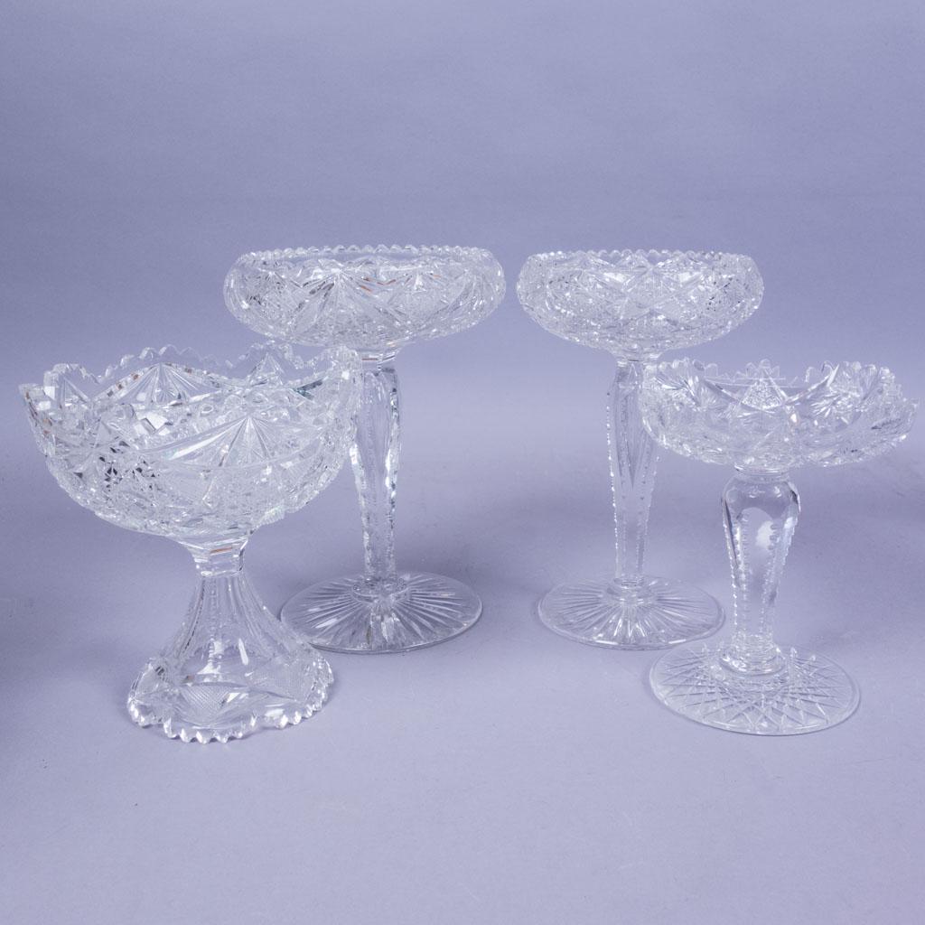 4 Assorted Stemmed Antique ABP Cut Glass Compotes: Four antique American Brilliant Period cut glass compotes of slightly different shapes and sizes featuring cross hatched and circular patterns. Largest 9.5" tall x 7" diameter, smallest 7" tall x 6" d