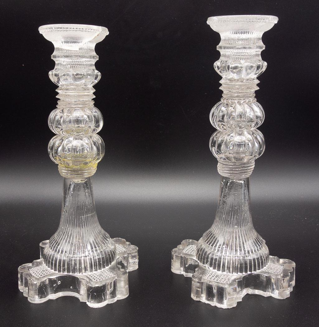 Antique 19c Pair Lacy Flint Sandwich Glass Candlesticks: An antique 19th century pair of clear sandwich glass Lacy Flint candlesticks with a fluted design. 4 1/2" x 9 3/4"