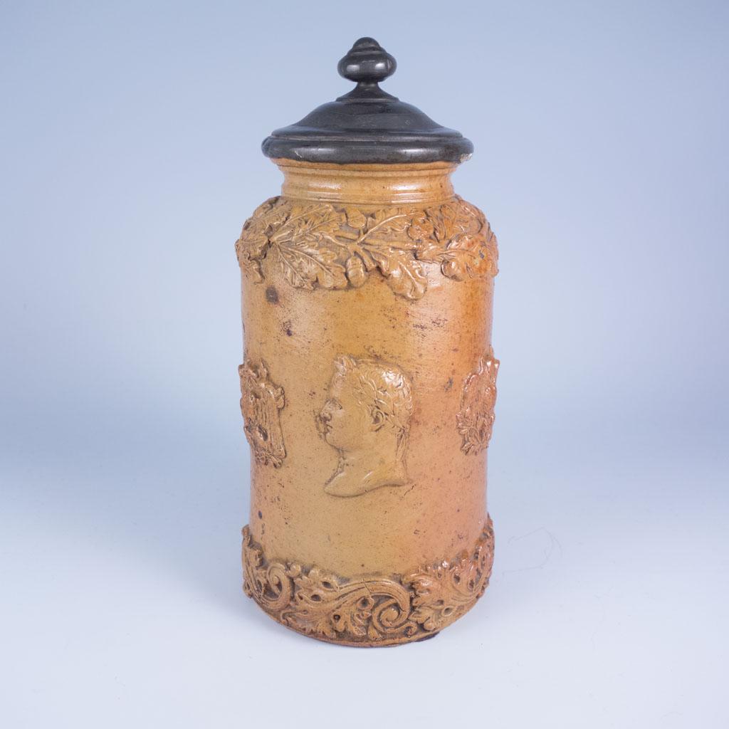 Antique French Empire Napolean Louis Philippe Jar: This is an antique 19th century stoneware lidded jar with an French eagle finial. Napoleon and Louis Philippe profiles are featured in relief. 7 1/2" tall