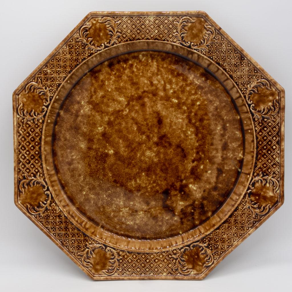 Don DG Carpentier Brown Salt Glaze Pottery Charger: A brown salt glazed octagonal charger by Don G. Carpentier (American, 1951-2014), a potter known for producing exceptional and sought after 20th century renditions of early English pottery. Please fol