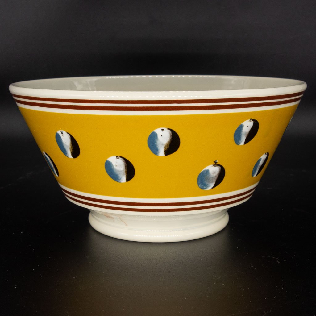 Don DG Carpentier Mochaware Round Bowl: This mochaware round bowl was produced by Don G. Carpentier (American, 1951-2014), a potter known for making exceptional and sought after 20th century renditions of early English pottery. This yellow
