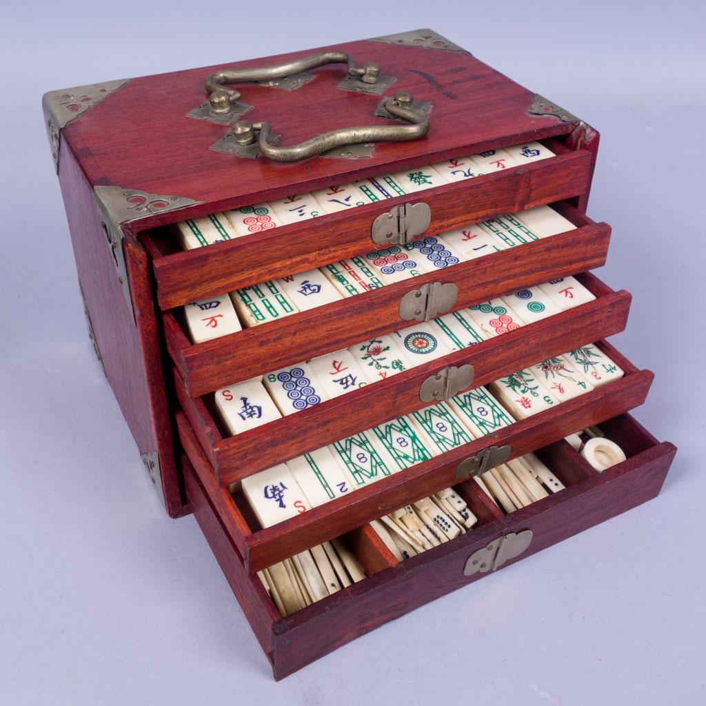 Antique Dovetailed Cased Chinese Mahjong Set: This is an antique Mahjong set dating to the early 20th century. The set features bovine bone tiles and counters. Housed in a dovetailed Chinese wooden five draw box with brass mounted details. The se