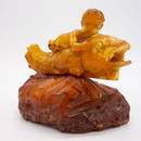 Baltic Egg Yolk Butterscotch Amber Eros on Fish Carving