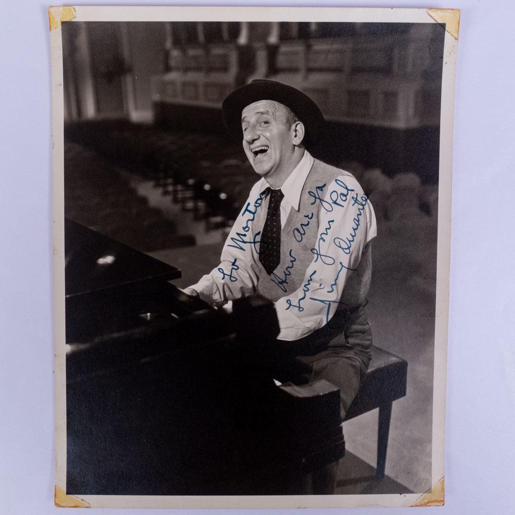 Autograph Signed Photo of Jimmy Durante Playing Piano: An autographed signed photograph of American actor Jimmy Durante playing the piano. We guarantee the authenticity of all autographs for the lifetime of the buyer. 10 x 8"