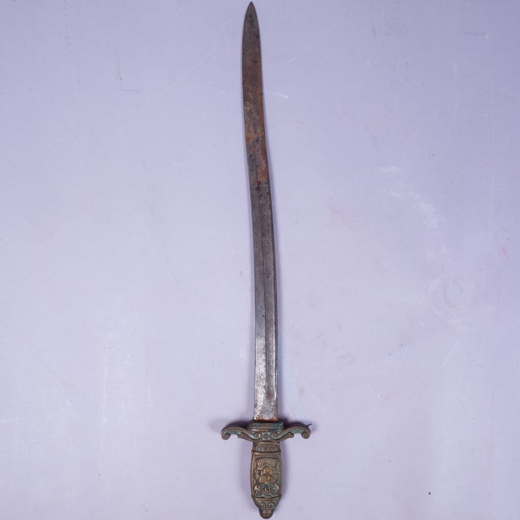 19c Roman Short Sword w Bronze Hilt Armor Motif: This 19th century Roman bronze short sword features an armor motif on the hilt. 28" x 5" at widest point of hilt