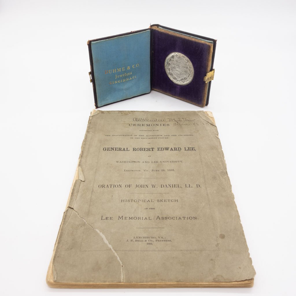 Robert E Lee Commemorative Silver Medal and Book: A commemorative Robert E. Lee monument silver coin in a booklet produced by Duhme & Co. for the Cincinnati Industrial Exposition of 1879. It is accompanied by a thin paperback book titled, Ceremonies