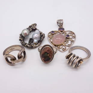 5 Silver Rings and Pendants with Opal Pearl and Quartz: This is a lot of three sterling silver rings and two sterling silver pendants. The sterling silver ring is in the shape of a horse bit and is a size 6.5. The second sterling silver ring is a size 6