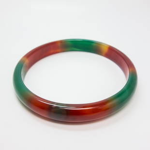 Agate Bangle w Chrysoprase and Carnelian Growth Zones: This solid carved agate bangle shifts from green to red with chrysoprase and carnelian growth zones. 3" diameter, 8" interior measurement, 19.8dwt.