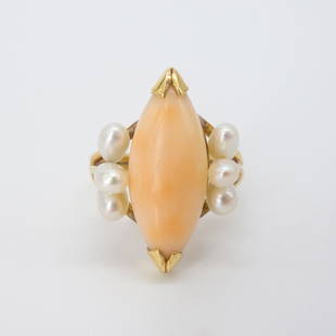 Vintage Pink Angel Skin Coral Pearl 14K Gold Ring: This is a vintage 14K gold ladies ring set with pink angel skin coral accented by six pearls. Size: 5.5 US. Weight: 4g. Face: 21.6 x 15mm. Coral Dimensions: 17 x 7.8mm. The pearls range from 3.8-5mm. 