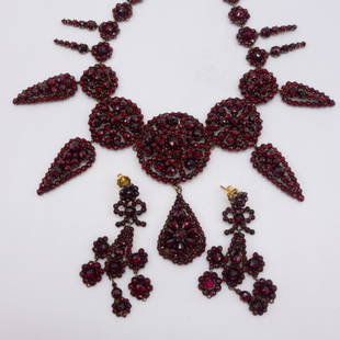 19c Bohemian Garnet Necklace Earrings Suite: This is an antique 19th century Bohemian garnet necklace earrings suite. Each features ornate dangle clusters of garnets. The earring backings are 14K gold. Necklace: 16" long and the central pendant