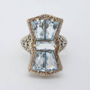 Art Deco 14K White Gold Filigree Aquamarine Bow Ring: This is an antique Art Deco 14K white gold filigree ring with an aquamarine bow motif. Size: 4.75US. Weight: 3.1g. Face: 19.7 x 11.4mm. Aquamarine Dimensions: Middle, 5.8 x 2.5mm. Flanking, 6.1 x 2.5-