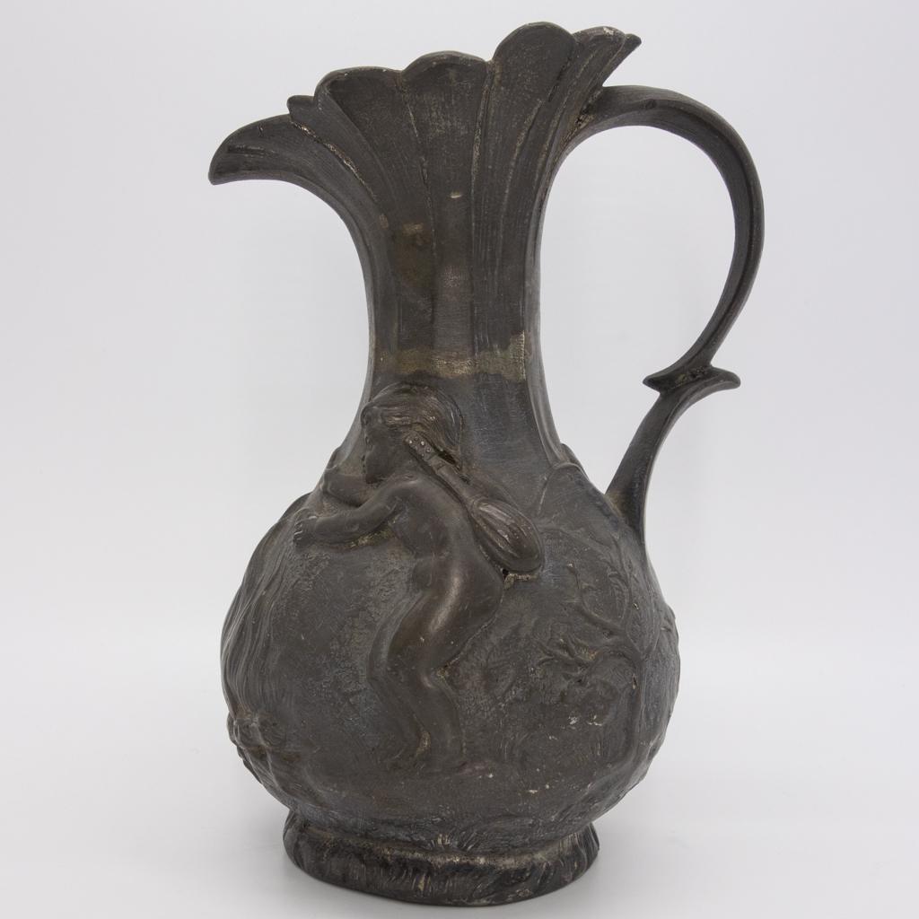 Charles Perron Art Nouveau French Pewter Pitcher: This is an antique Art Nouveau pewter pitcher designed by Charles Perron (French, 1862-1934). The floraform pitcher features a landscape scene with two children. Signed Ch. Perron. 6 3/8" tall