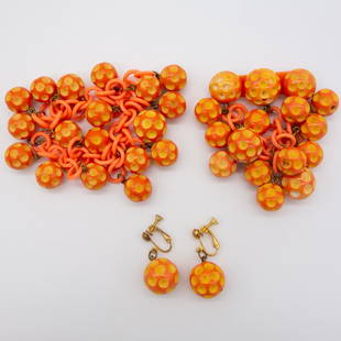 Mid Century Bakelite Ball Earrings Brooch Bracelet Set: This is a vintage Mid Century lot of Bakelite jewelry including a pair of dangle earrings, bracelet, and brooch pin. Each features a coral, yellow, and orange ball motif with crater dots. The