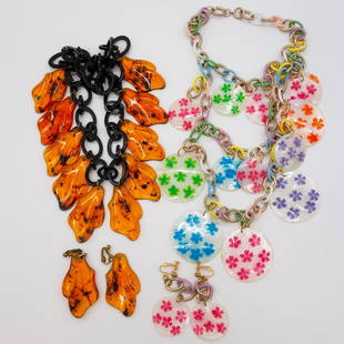 2 Sets Vintage MCM Lucite MOP Necklace Earrings Suite: This is a vintage lot of two sets of necklace and earrings suites including floral painted Mother of Pearl and lucite made to look like amber. The floral necklace neck length is 17". The "amber" neck