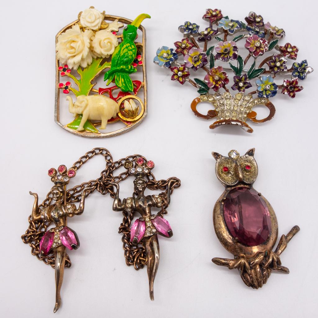 4 Vintage Brooches incl Sterling Jelly Belly Enamel: This is a vintage lot of four brooches dating to the mid 20th century. The lot includes sterling silver, enamel, carved bovine bone, and jelly belly. The dancers may be used as sweater clips. The flor