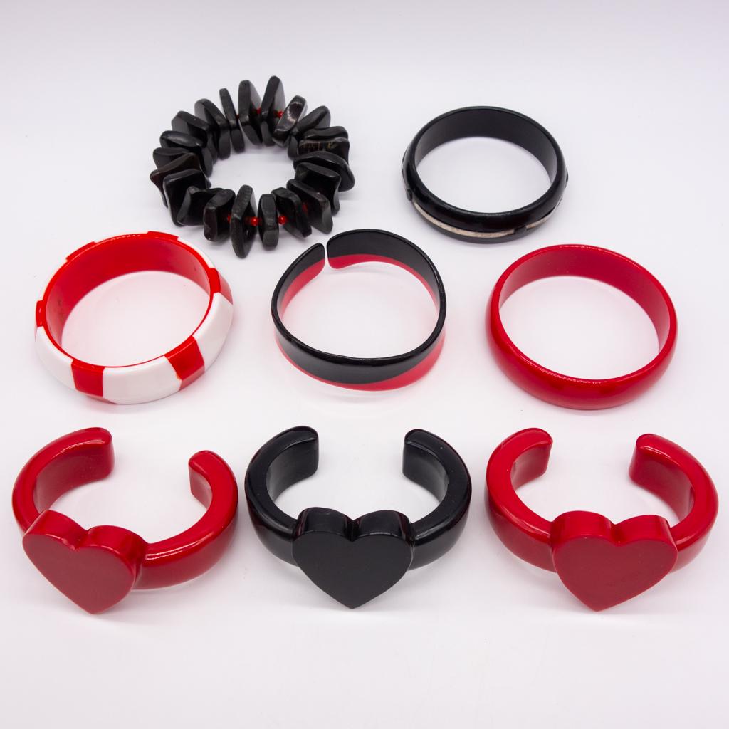 8 Vintage Plastic Red and Black Bracelets incl Hearts: This is a vintage lot of eight red and black ladies fashion bracelets including stretch and heart motif cuffs. The interior circumference of the heart cuff is 5 1/4 plus a 1 1/8" gap at the back.