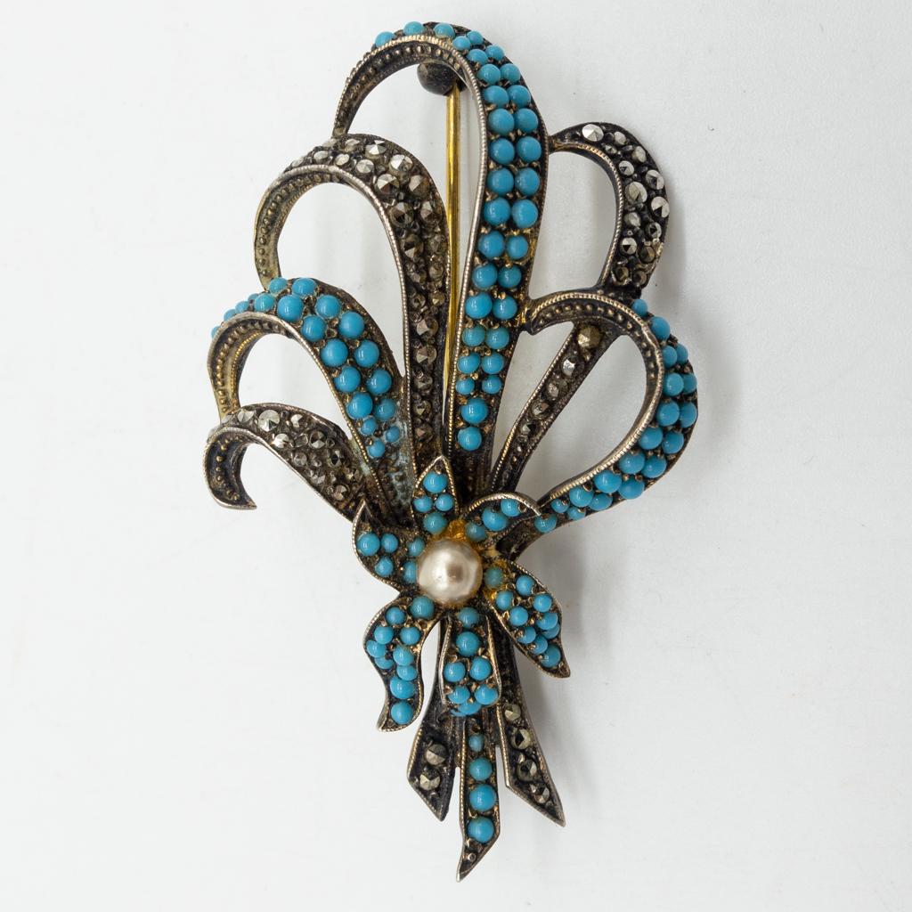 Art Deco German Sterling Silver Marcasite Pearl Brooch: This is an antique German sterling silver brooch pin studded with marcasites and glass turquoise cabochons. A cultured pearl is set at the center. 2 1/4 x 1 1/4". It weighs 11.1g.