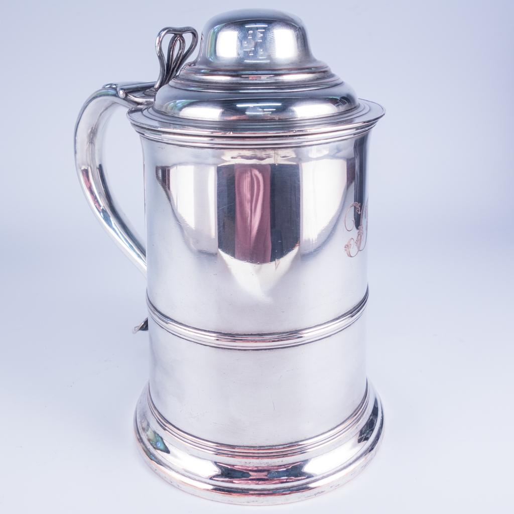 English Sheffield Silver SP Copper Georgian Tankard: This is an antique English Sheffield silverplated tankard dating to the 19th century. Monogrammed. Dimensions: 8" Tall. The mouth and base diameter are 4 1/4" and 5 1/4" respectively.