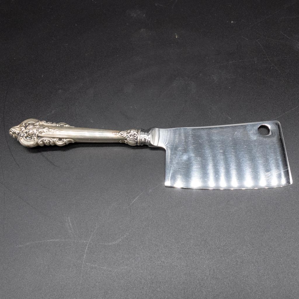 Wallace Grand Baroque Sterling Silver Cheese Cleaver: This is a vintage and uncommon sterling silver "Grand Baroque" handle cheese cleaver made by Wallace of Wallingford, Connecticut. The blade is stainless steel. 6 3/4" long.