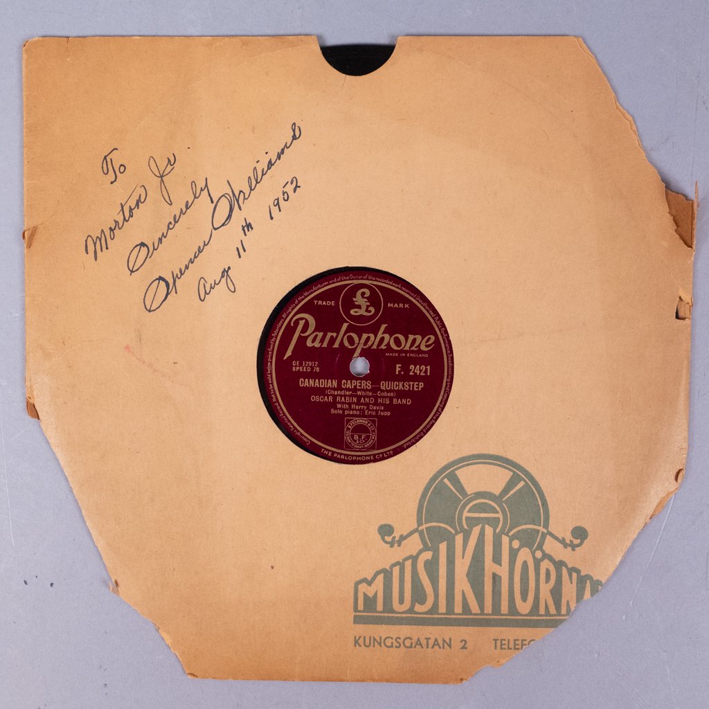 1952 Spencer Williams Autographed Vinyl Basin St Blues: This an original vinyl recording of Oscar Rabin And His Band playing Spencer Williams' Basin Street Blues, and Chandler, White, Cohen's Canadian Capers. The record sleeve is inscribed and autographed