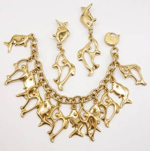 Vintage Yves Saint Laurent YSL Fish Motif Bracelet and Earrings Suite: This is a vintage bracelet and earrings suite with a dangle fish motif from Yves Saint Laurent. The bracelet is 8.5". The earrings are 3 5/8". 