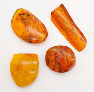 Lot 4 Natural Baltic Amber Pieces incl Butterscotch: This is a lot of four pieces of Baltic amber including a nice chunk of butterscotch amber. The long piece is 2 7/8". The butterscotch chunk is 1 5/8 x 1 1/2". The total weight is 69.6g