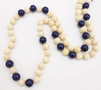 Vintage Lapis and Coral Bead Single Strand Necklace 30": This is a vintage lapis and coral bead single strand necklace It is 30" long and it weighs a total of 122.8g. The beads range from 10-12.5mm