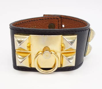 Vintage Octopussy Paris Leather Bracelet Cuff w Brass Studs: This is a vintage leather cuff bracelet with brass studs and decorative bull ring. Stamped for Octopussy of Paris. The max wearable length is 7"