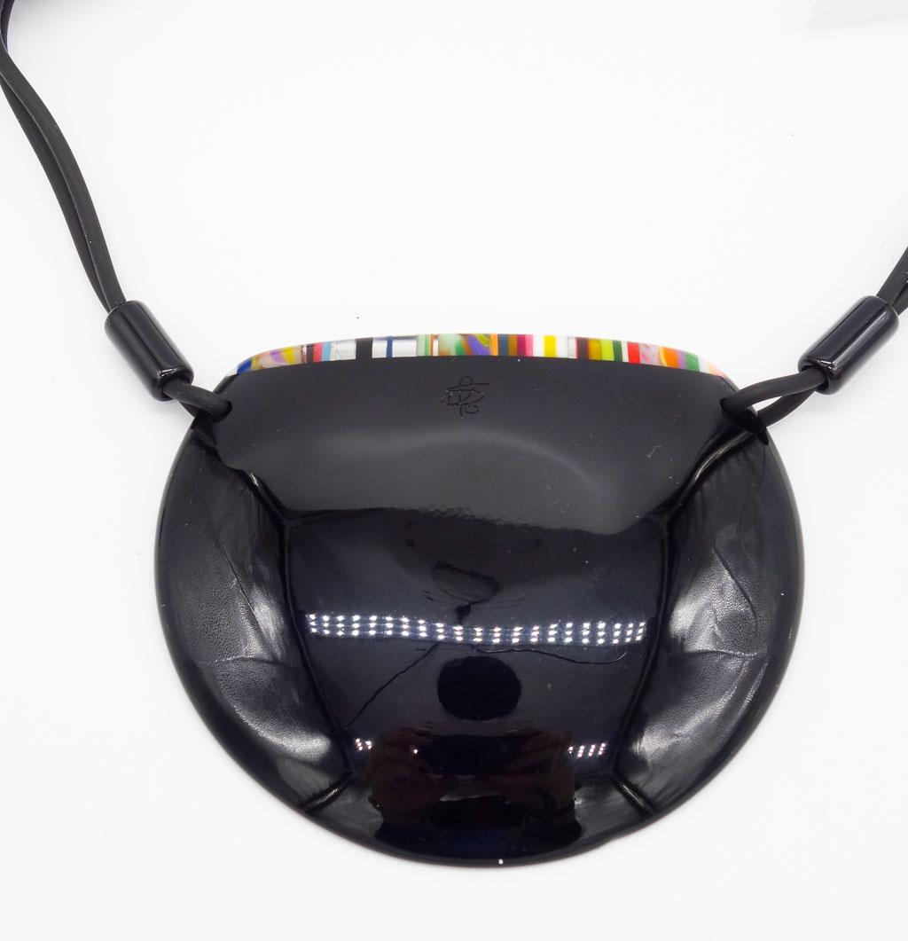 Sobral Pop Art Resin Black Disc Necklace with Colorful Stripes: This is a vintage resin necklace from Brazilian designer Carlos Sobral. The black disc necklace is accented with a colorful line of stripes. The necklace length is 18". The pendant is 3 1/2 x 3".