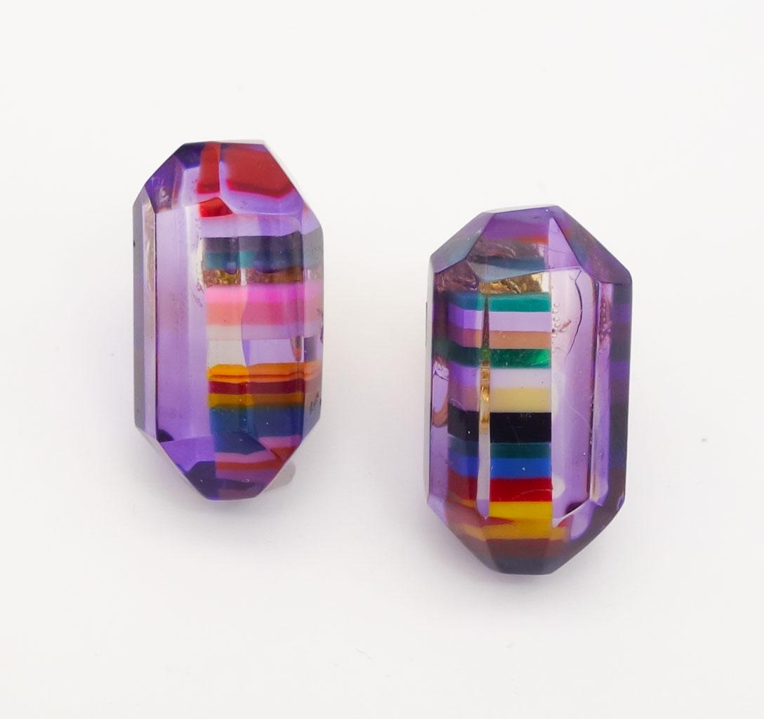 Pair Sobral Pop Art Purple Resin Rainbow Stripe Prism Earrings: This is a vintage pair of purple resin clip-on earrings from Brazilian designer Carlos Sobral. The prisms are accented with a colorful stripes. Each is 1 1/8" long