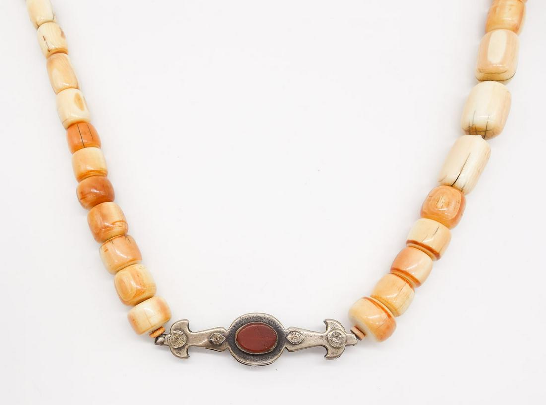 Vintage Beaded Sterling Silver Carnelian Necklace: This is a vintage beaded necklace featuring a sterling silver and carnelian accent. The necklace is 44" long.